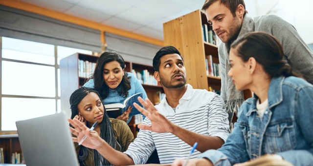 Students collaborating in the library